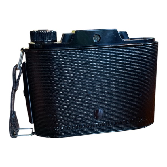 Black Film Photography Camera with Textured Body and Circular Lens - Picture 6 of 11